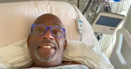 Al Roker in a hospital bed poses for a selfie.